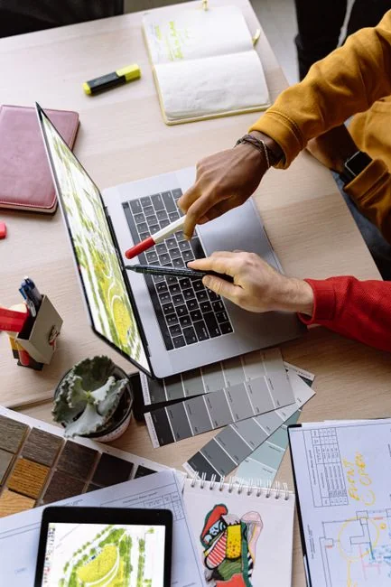 A contemporary workspace showcasing a laptop, tablet, and smartphones, ideal for tech and freelance use.